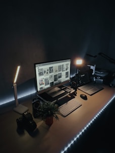 A clean webcam setup on a minimalist desk with soft tan lighting, no people.