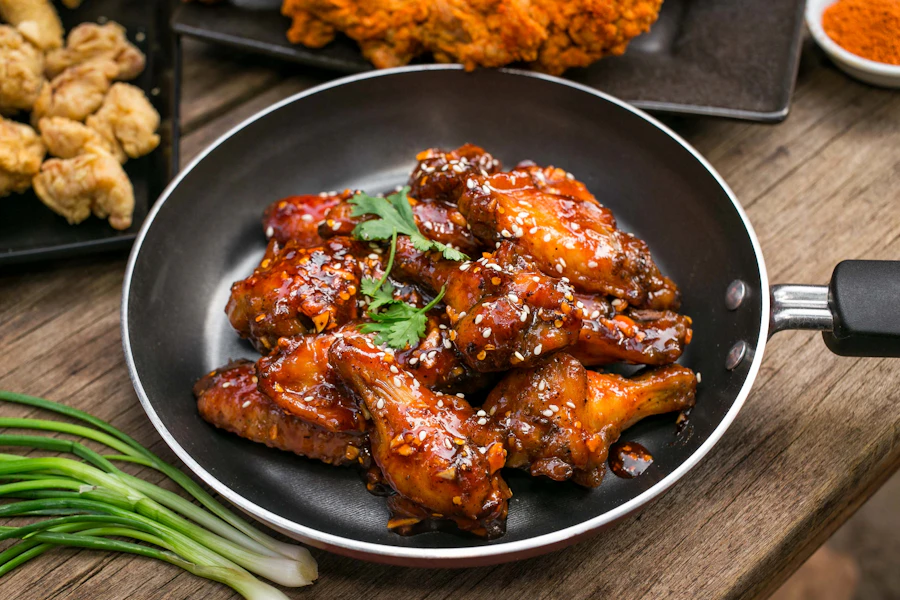 A loaded box of Korean fried chicken with sides