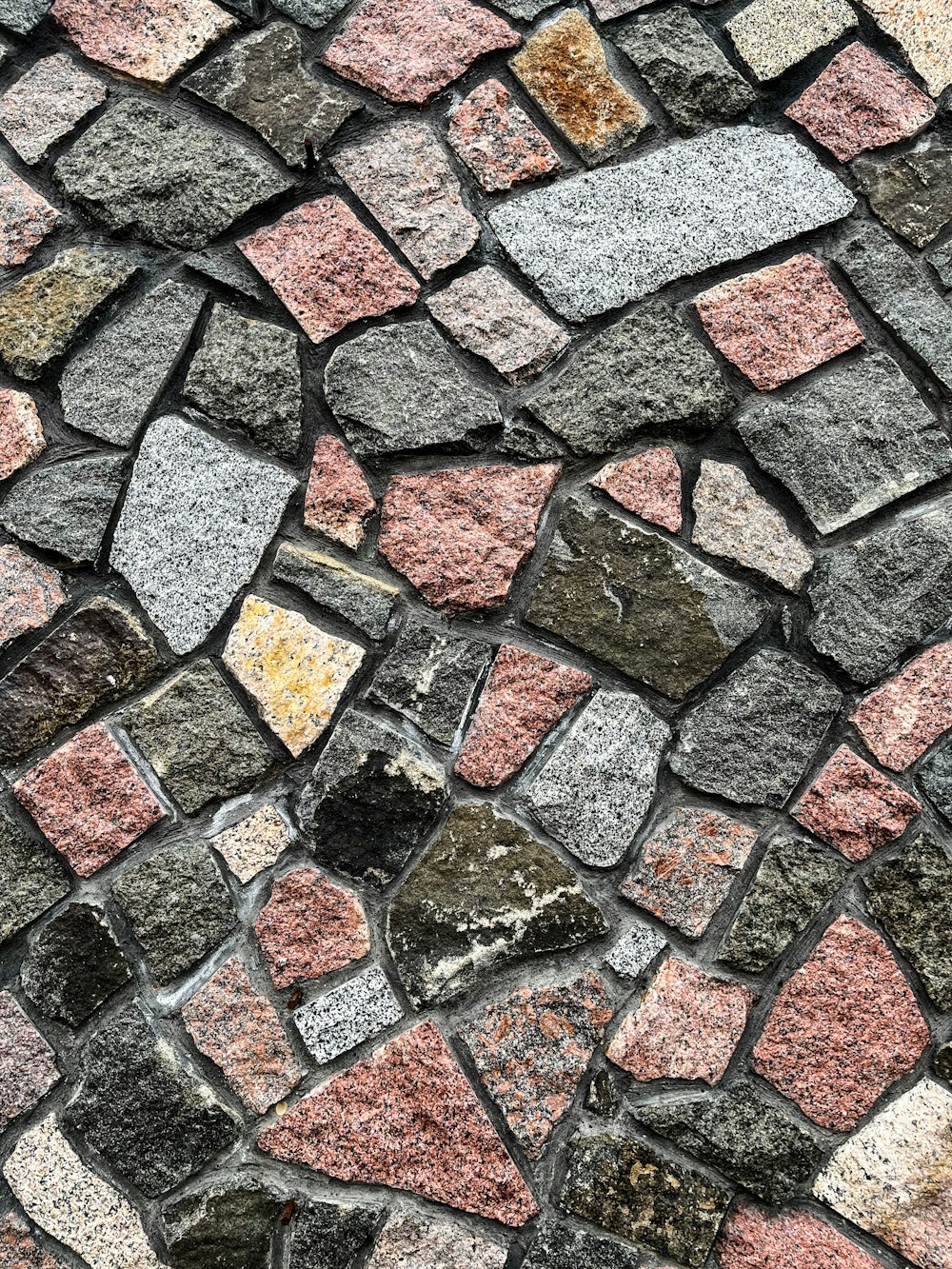 a close up of a stone wall made of small rocks