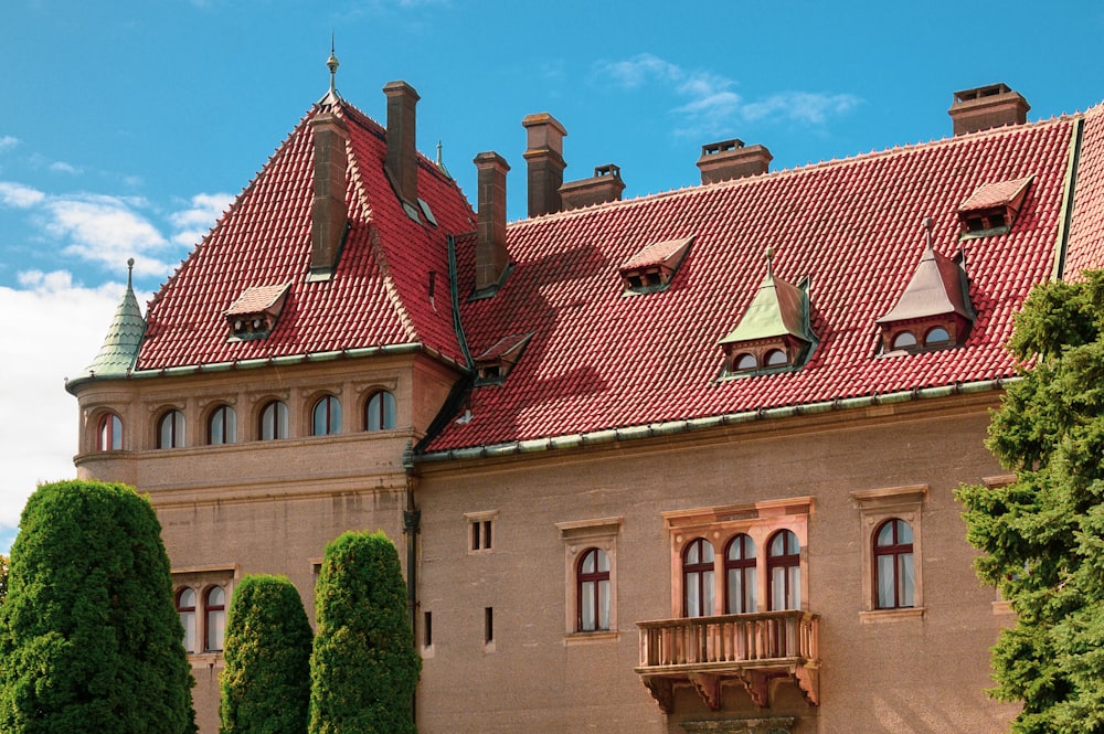 a large building with a red tiled roof