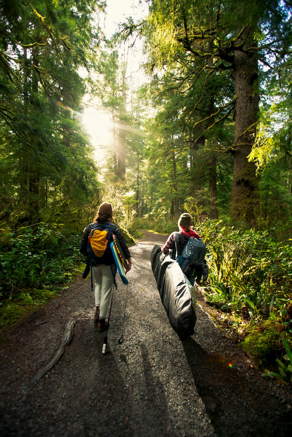 a couple of people that are walking down a road