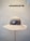 A beige wide-brimmed hat is displayed on a stand against a neutral background. Above the hat, the text 'HUTMANUFAKTUR SEIT 1903' is visible, suggesting a hat manufacturer established in 1903.