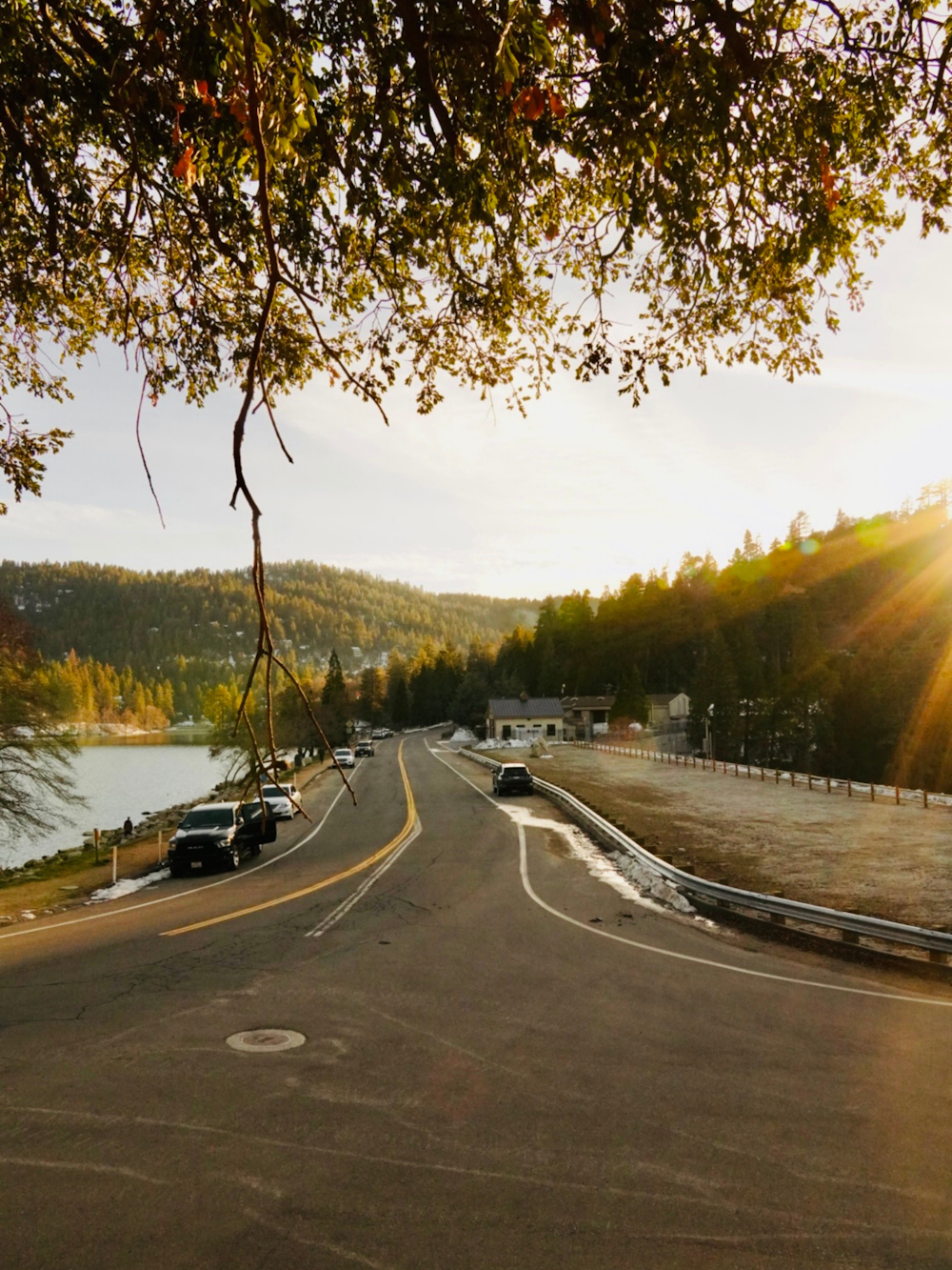 a street with cars parked on the side of the road