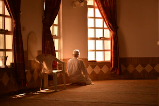 A serene coaching session with Shehnaz Matheen, sunlight streaming through a cozy room.