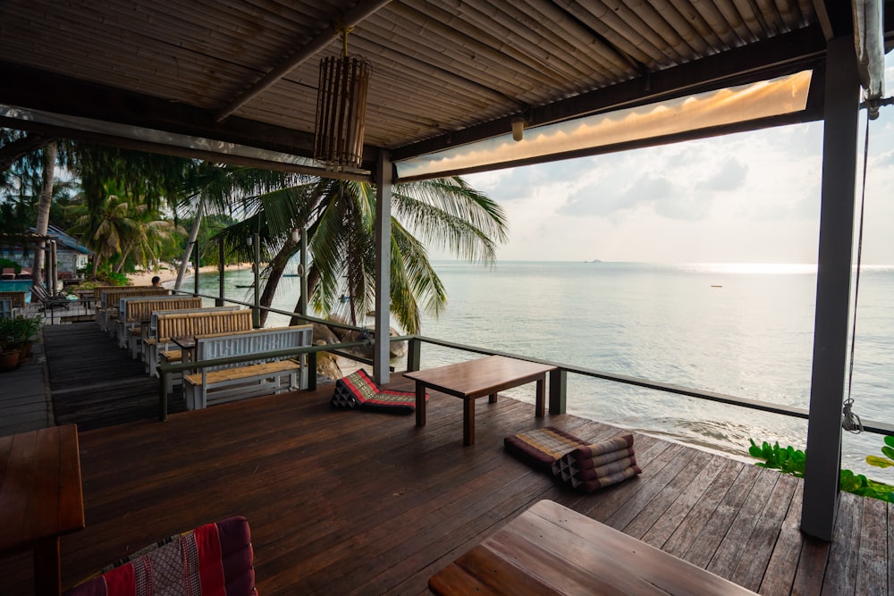 a wooden deck with a table and chairs on it