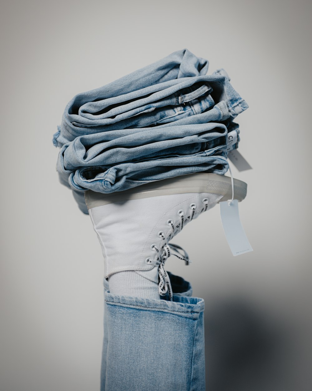 a stack of folded jeans in a jeans pocket