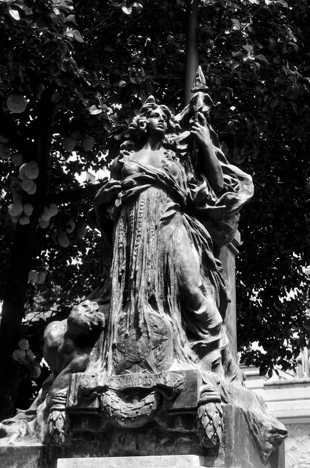 a black and white photo of a statue