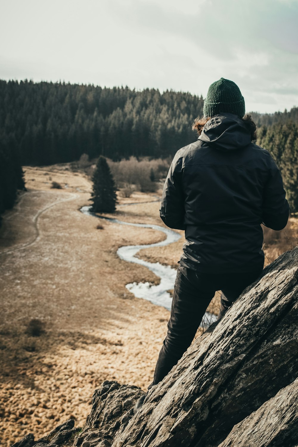 a man walking down a dirt road