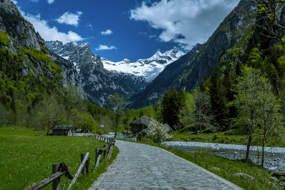 a stone path leading to a mountain village