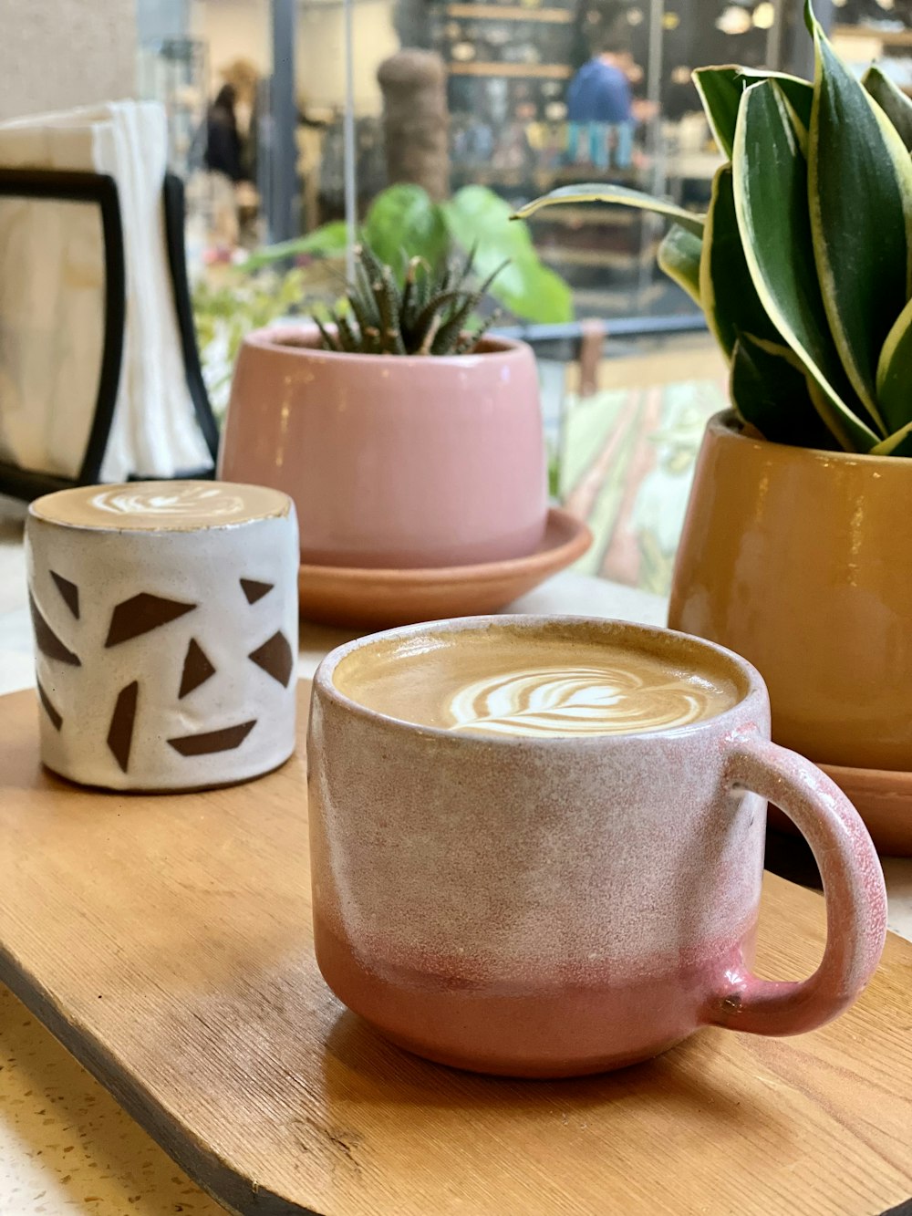 a couple of cups that are sitting on a table