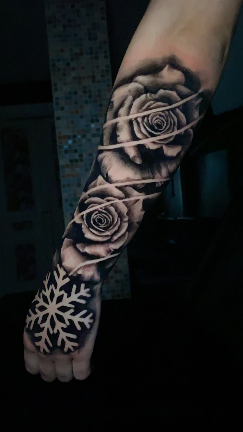 Cover-up dark floral sleeve tattoo