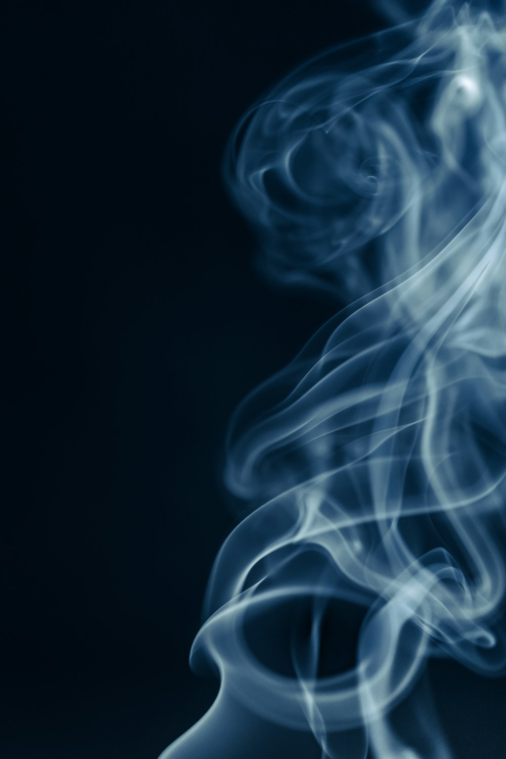 a close up of smoke on a black background