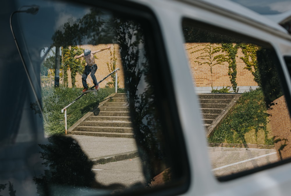 a man riding a skateboard down a set of stairs