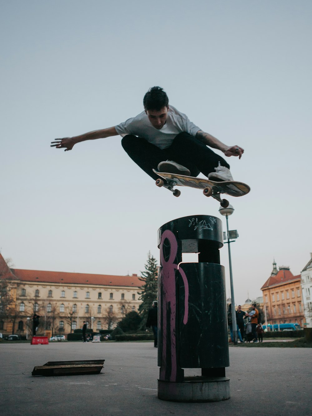 a man flying through the air while riding a skateboard