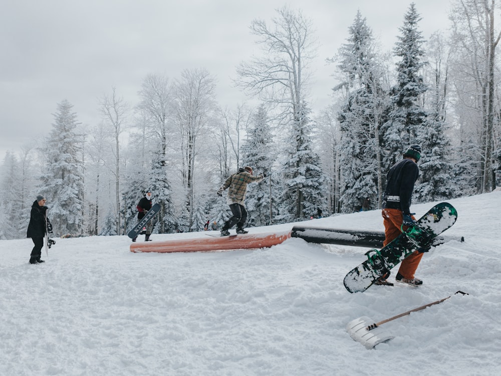 a group of people riding skis on top of a snow covered slope