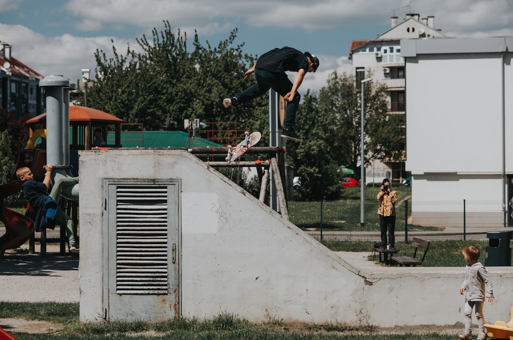 a man riding a skateboard up the side of a ramp