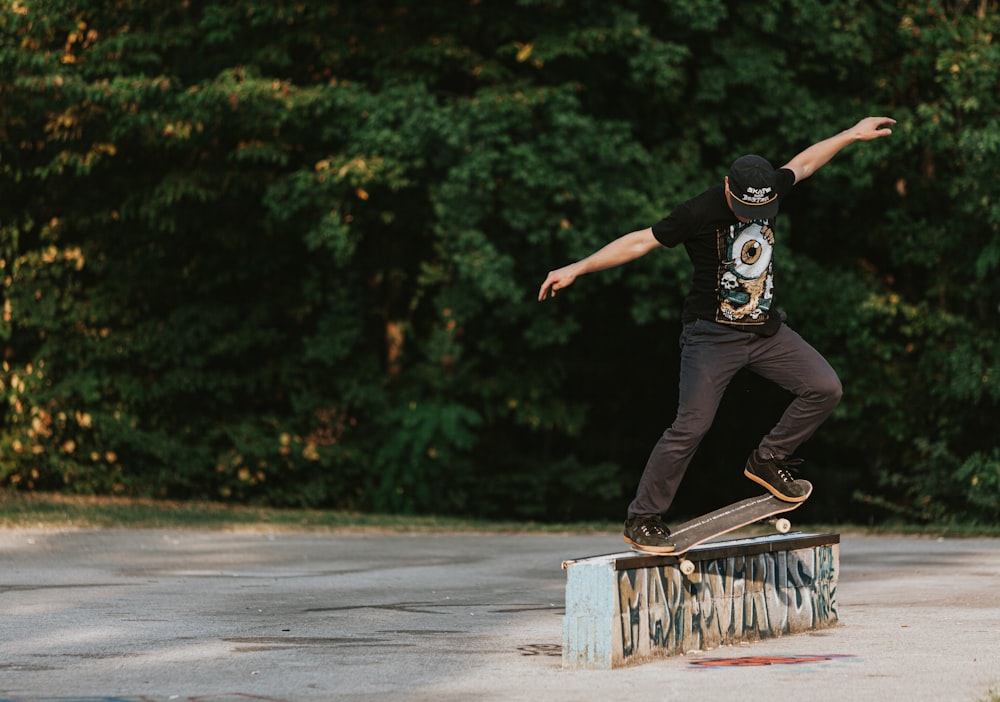 a man riding a skateboard on top of a metal rail