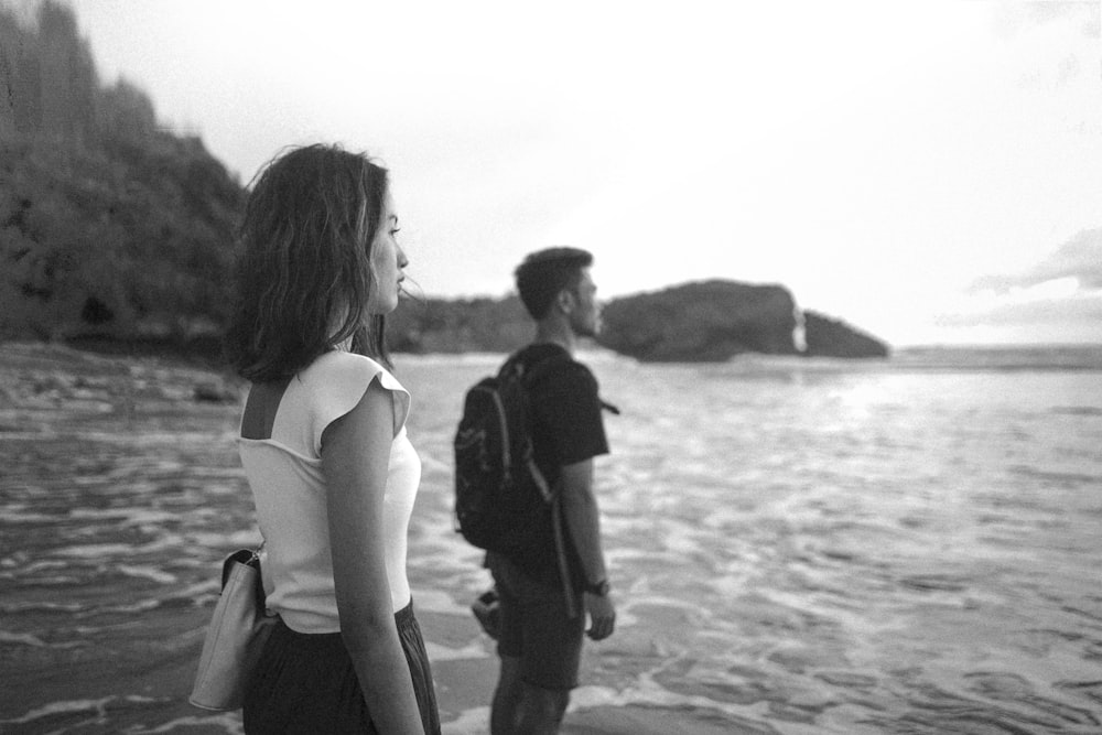 a man and a woman standing in the water