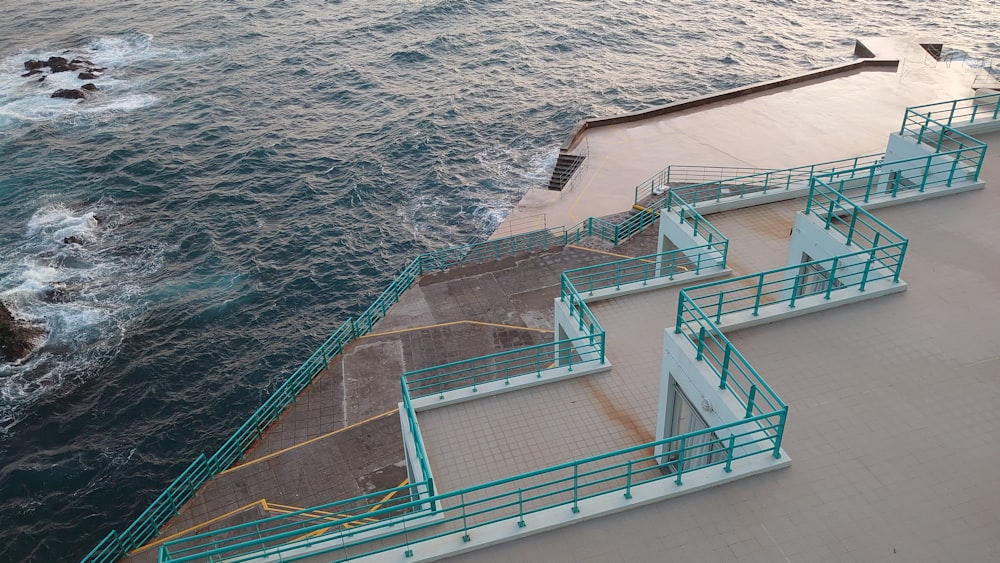 an aerial view of a pier with steps leading to the water