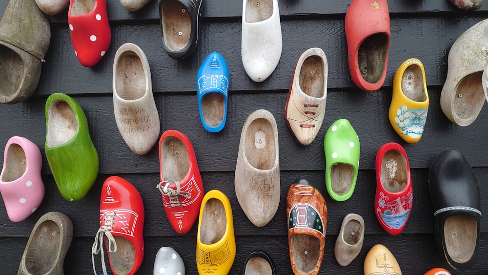 a bunch of shoes that are on a wall