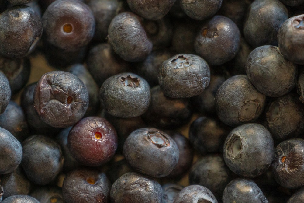 a bunch of blueberries that are sitting on a table