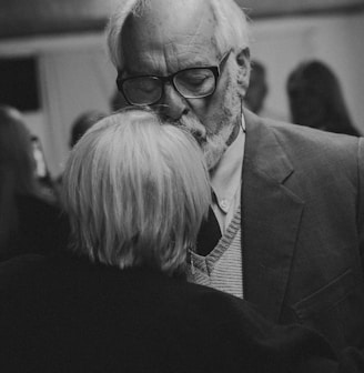 a black and white photo of a man and a woman