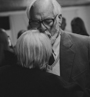 a black and white photo of a man and a woman