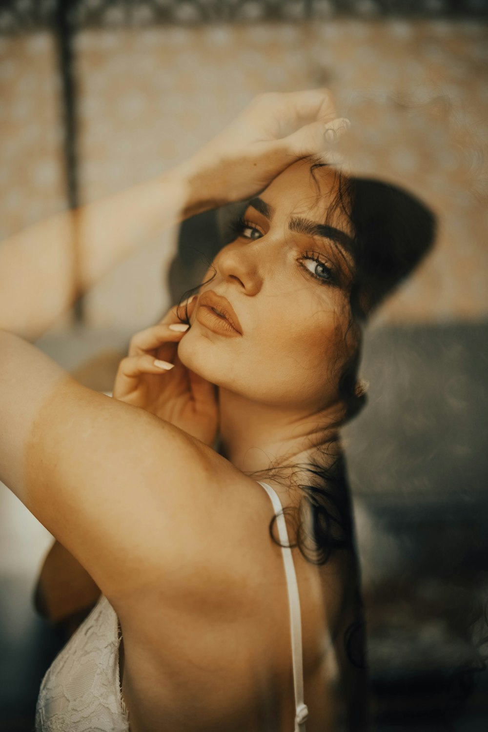 a woman with a hat is posing for a picture