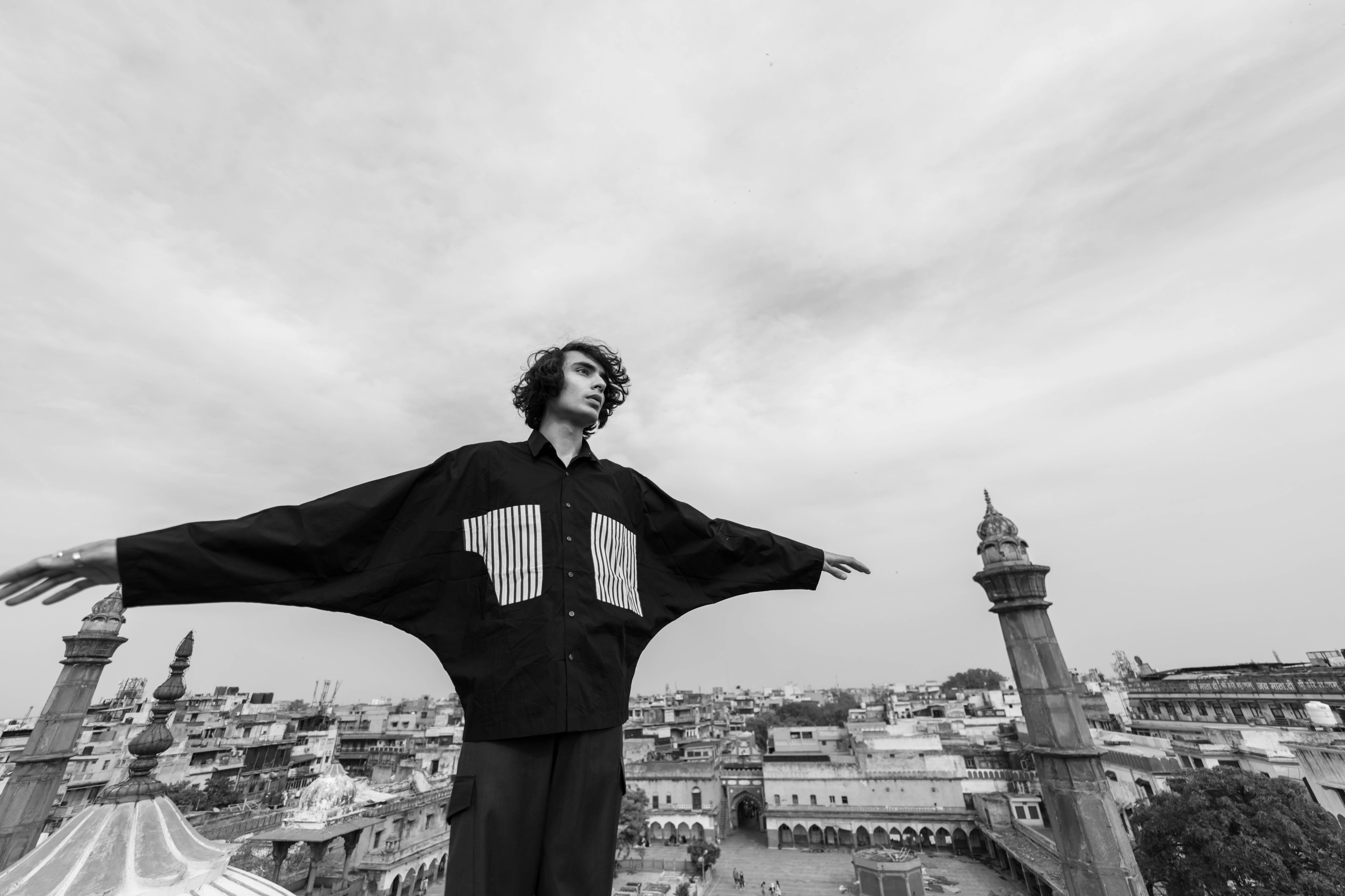 a man standing on top of a tall building