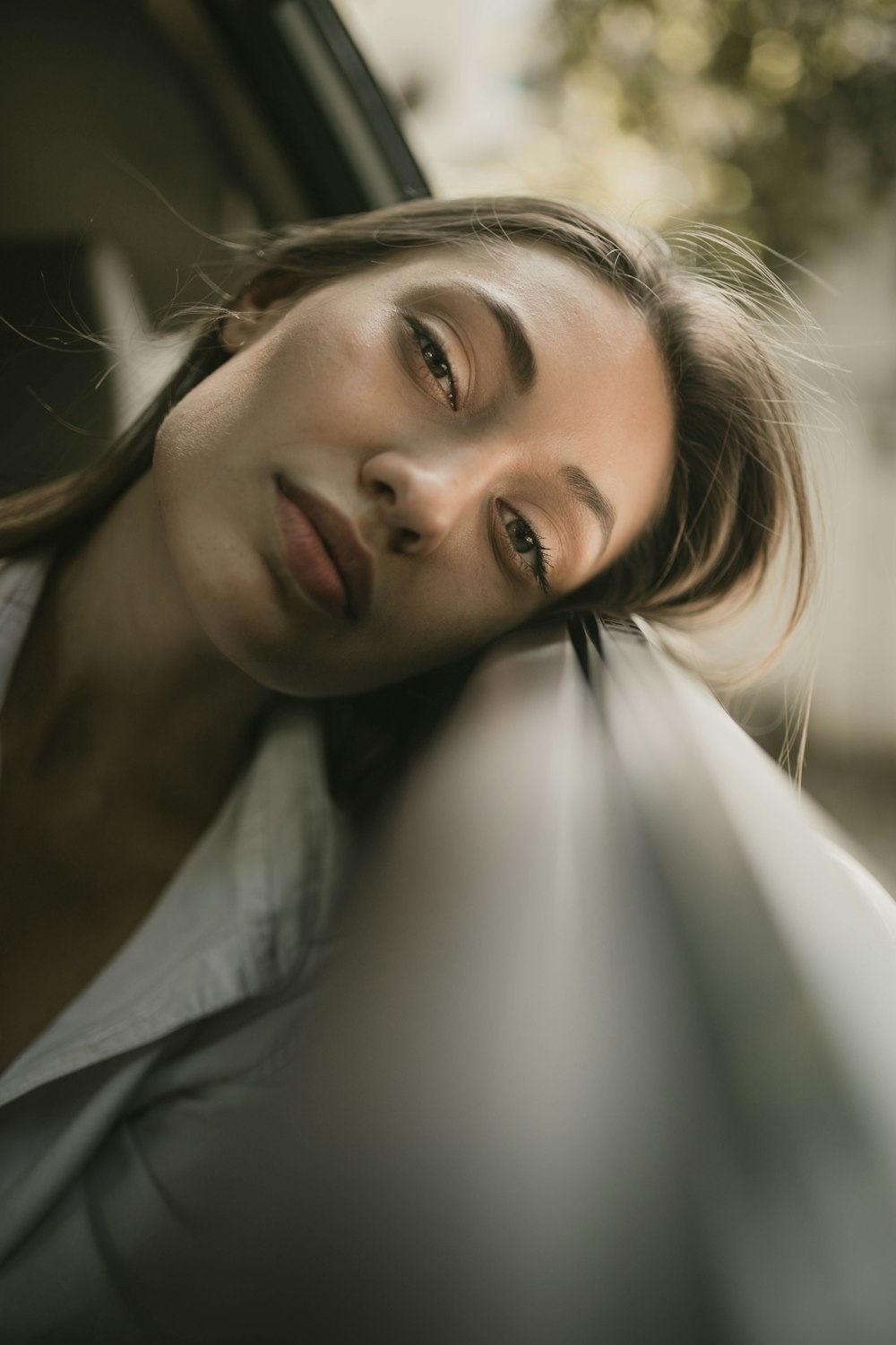 a woman leaning out the window of a car