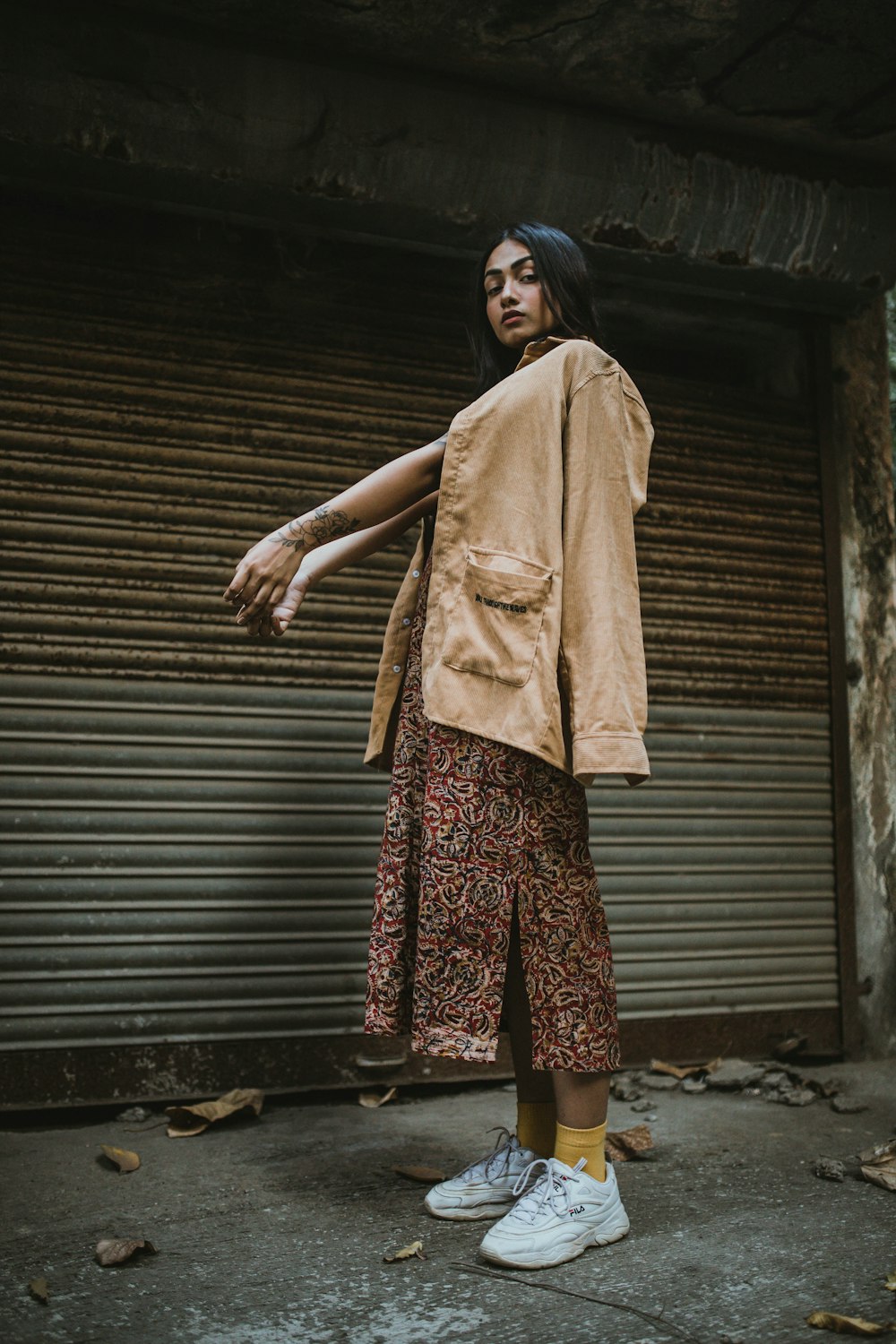 a woman standing in front of a garage door