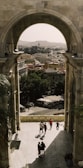 a group of people standing under an archway