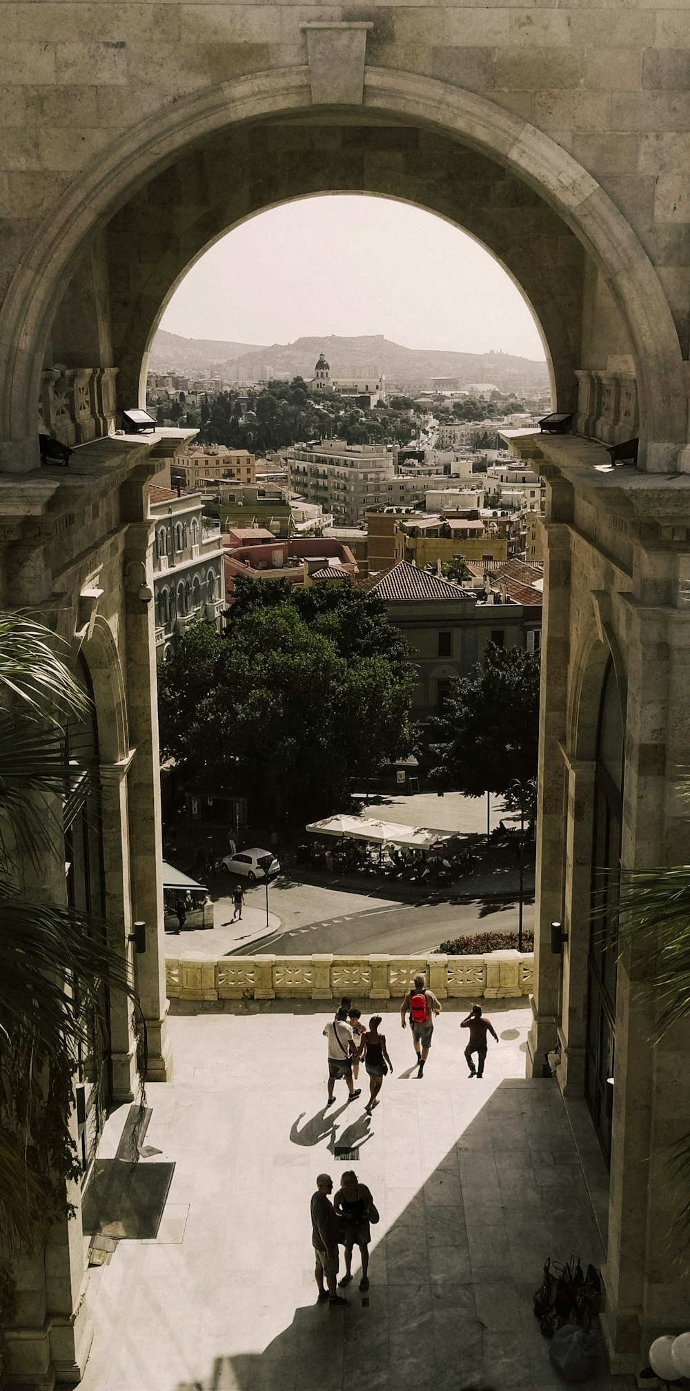 a group of people standing under an archway