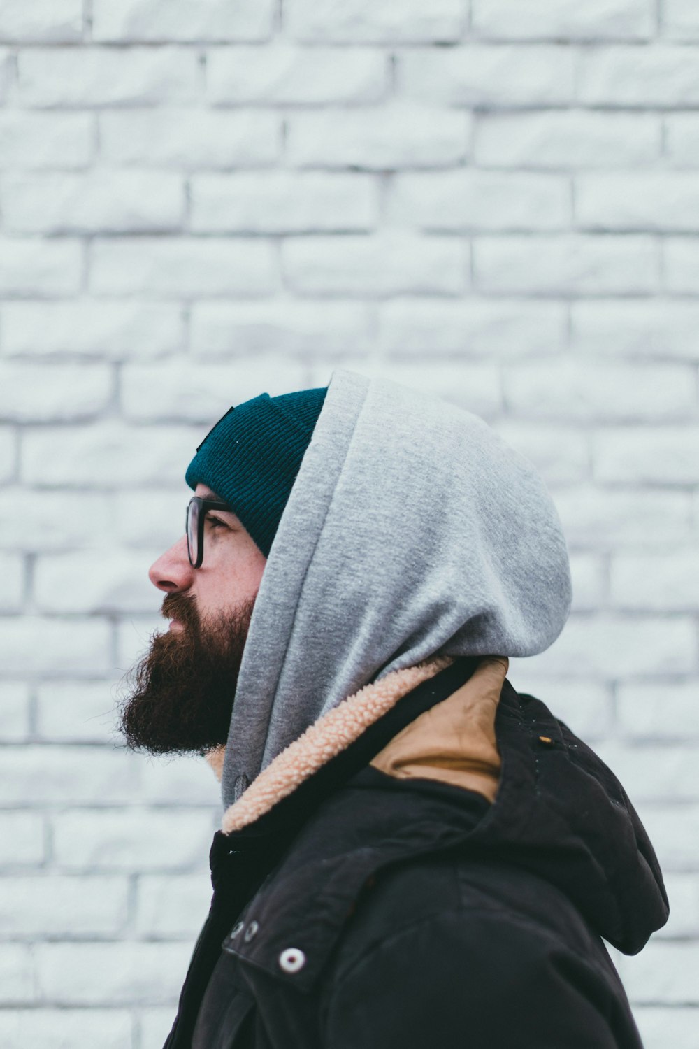 a man with a beard wearing a hoodie