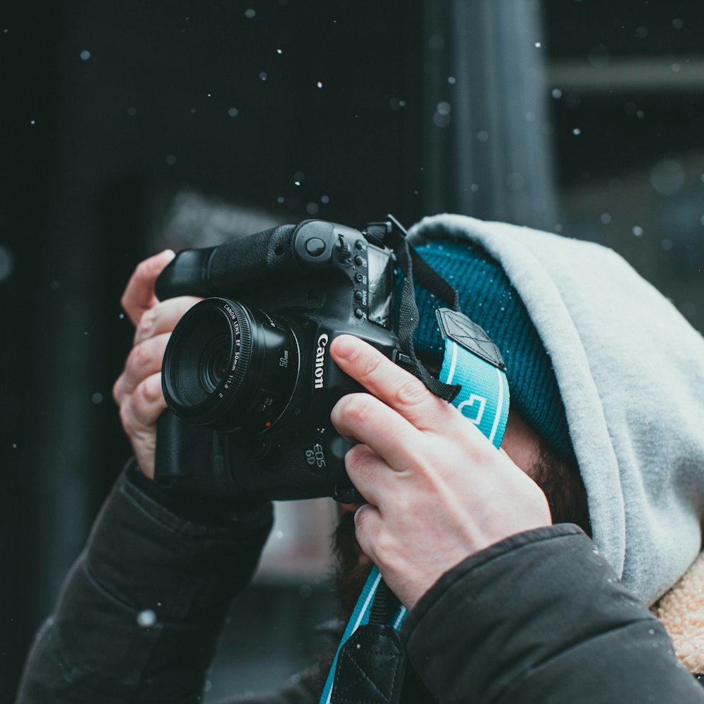 a person taking a picture with a camera