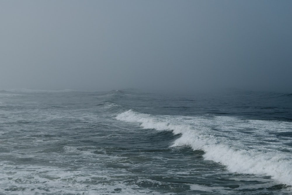 a large body of water with waves coming in