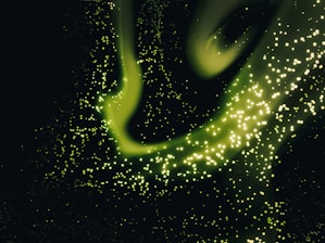 Glowing network nodes connecting across a dark emerald green digital grid background.