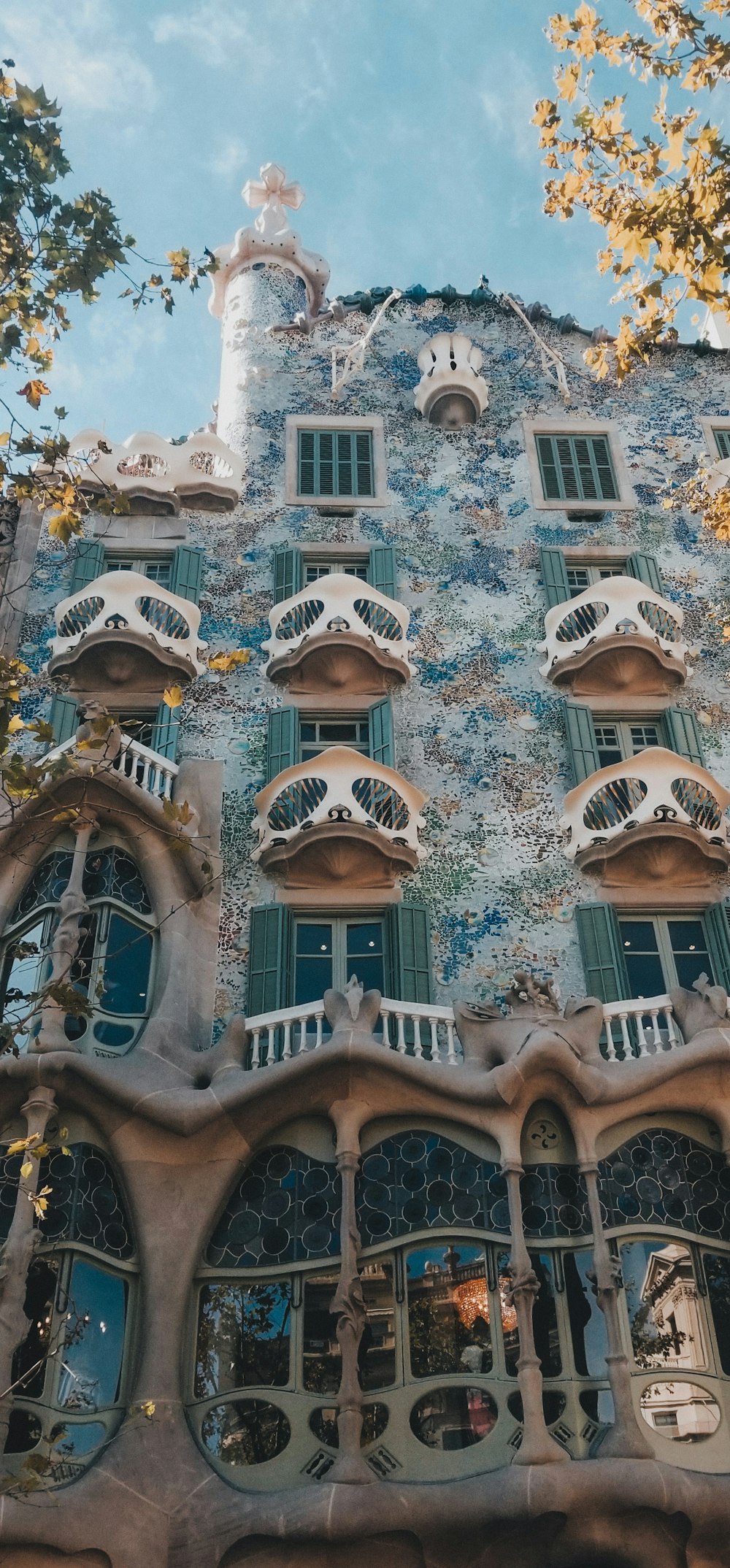 a tall building with lots of windows and balconies