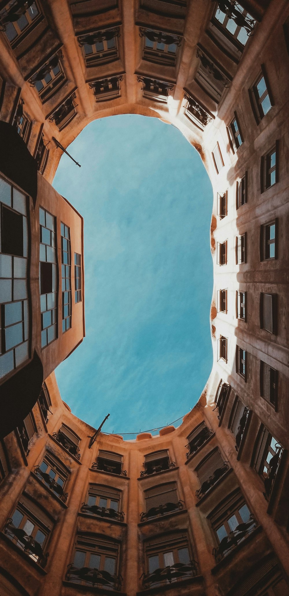 looking up at the sky from the inside of a building