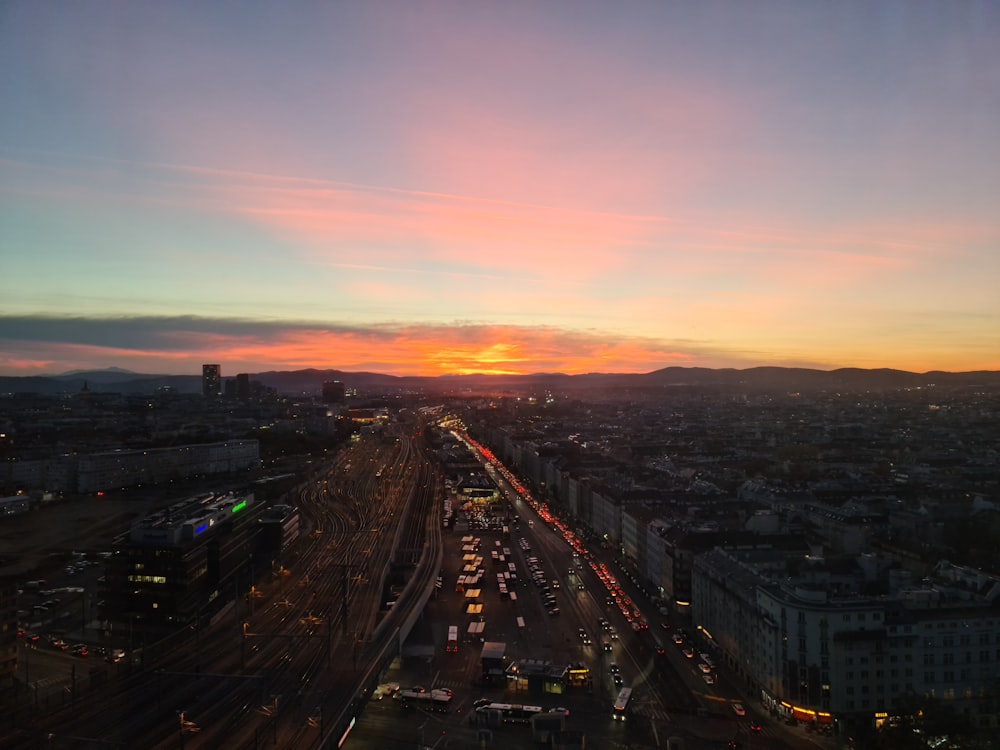 a sunset view of a city with a lot of traffic