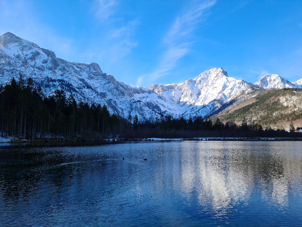 a lake with mountains in the background