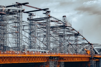a large metal structure sitting on top of a bridge