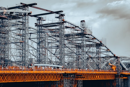 a large metal structure sitting on top of a bridge