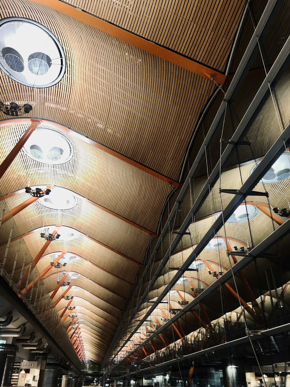 the ceiling of a train station is made of wood