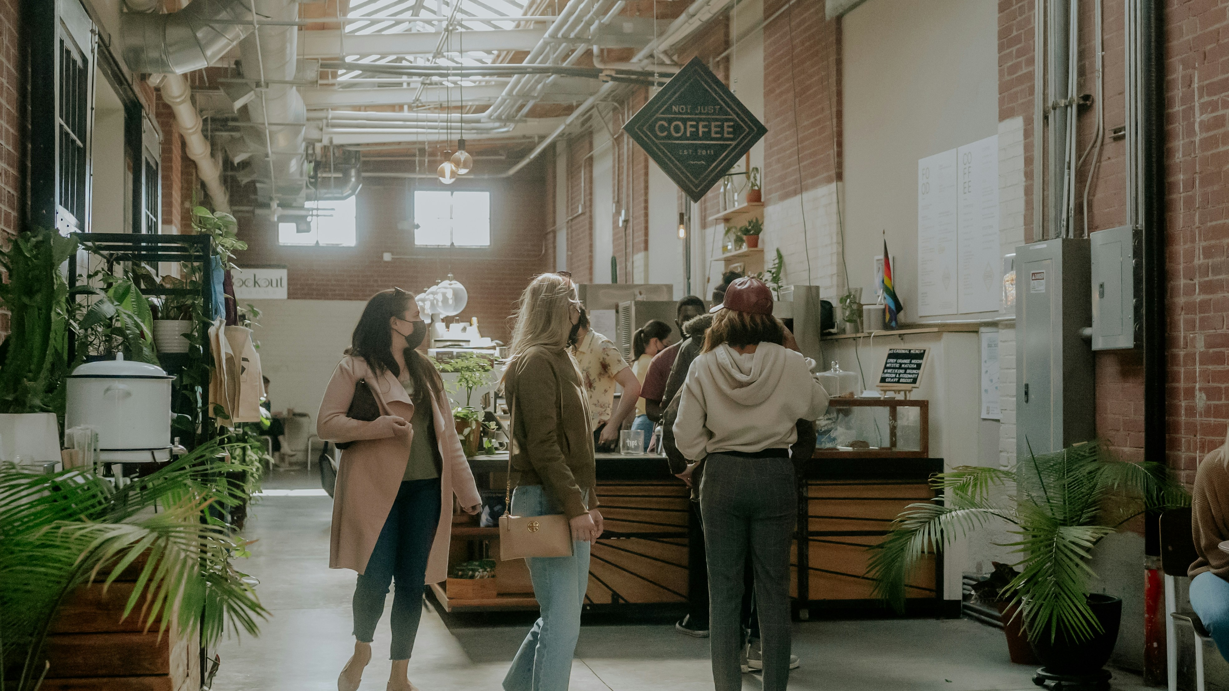 a group of people standing around a store