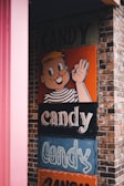 a sign on the side of a building that says candy candy candy candy candy candy