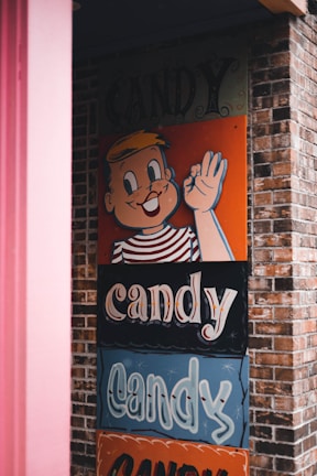 a sign on the side of a building that says candy candy candy candy candy candy