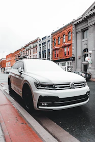 a white car parked on the side of the road