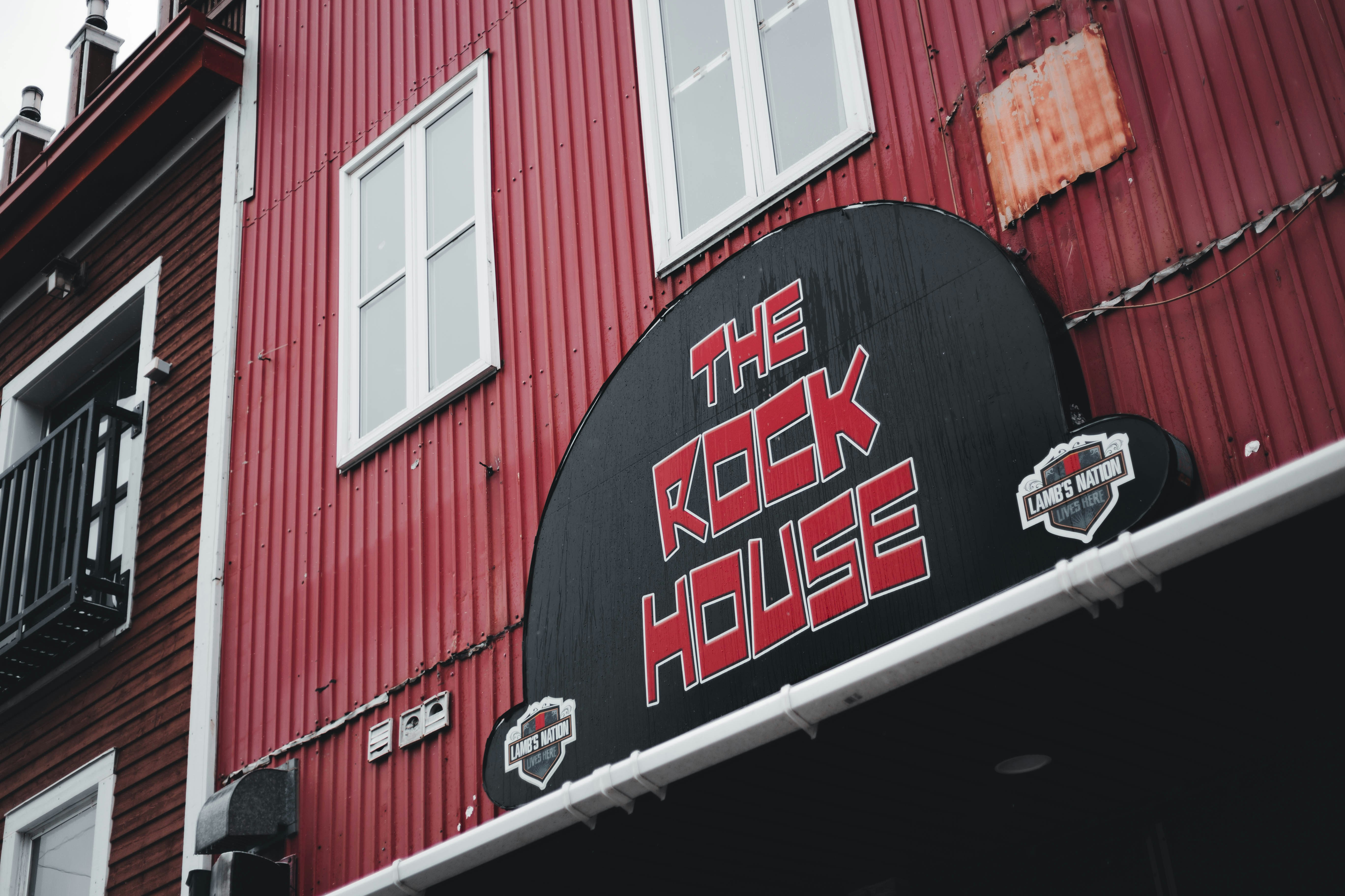 A red building with a sign that says the rock house photo – Free ...