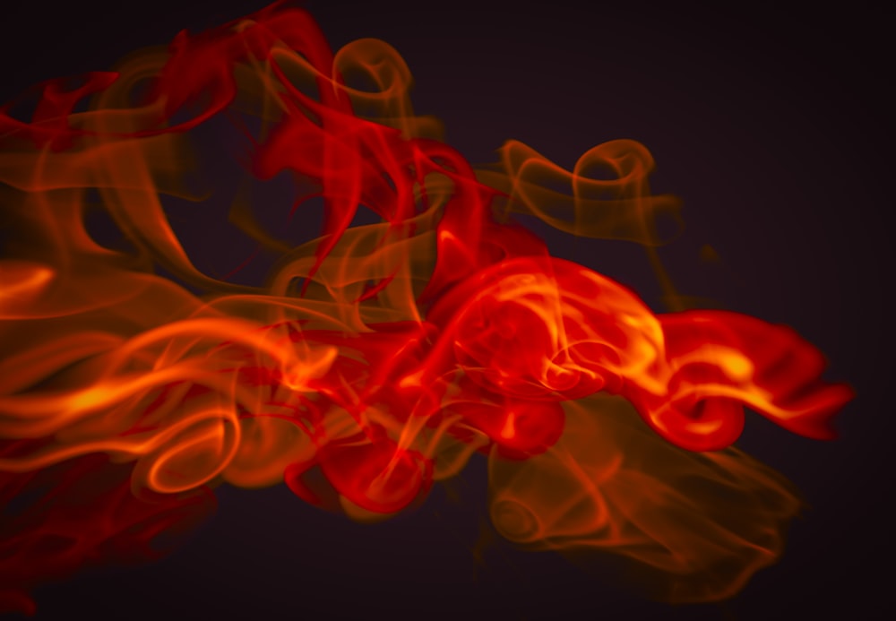 a red and yellow fire on a black background